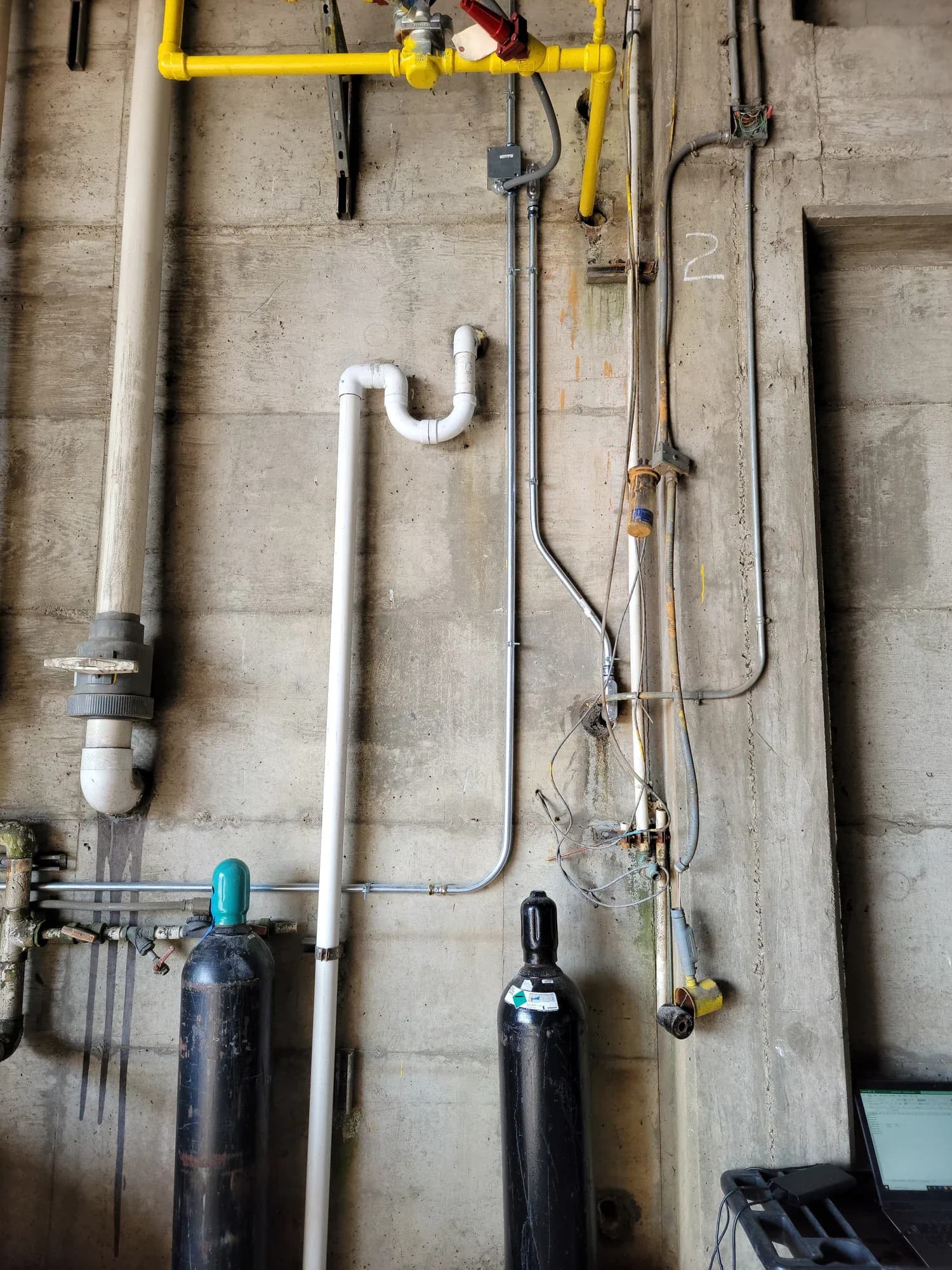 Conduit runs alongside building equipment