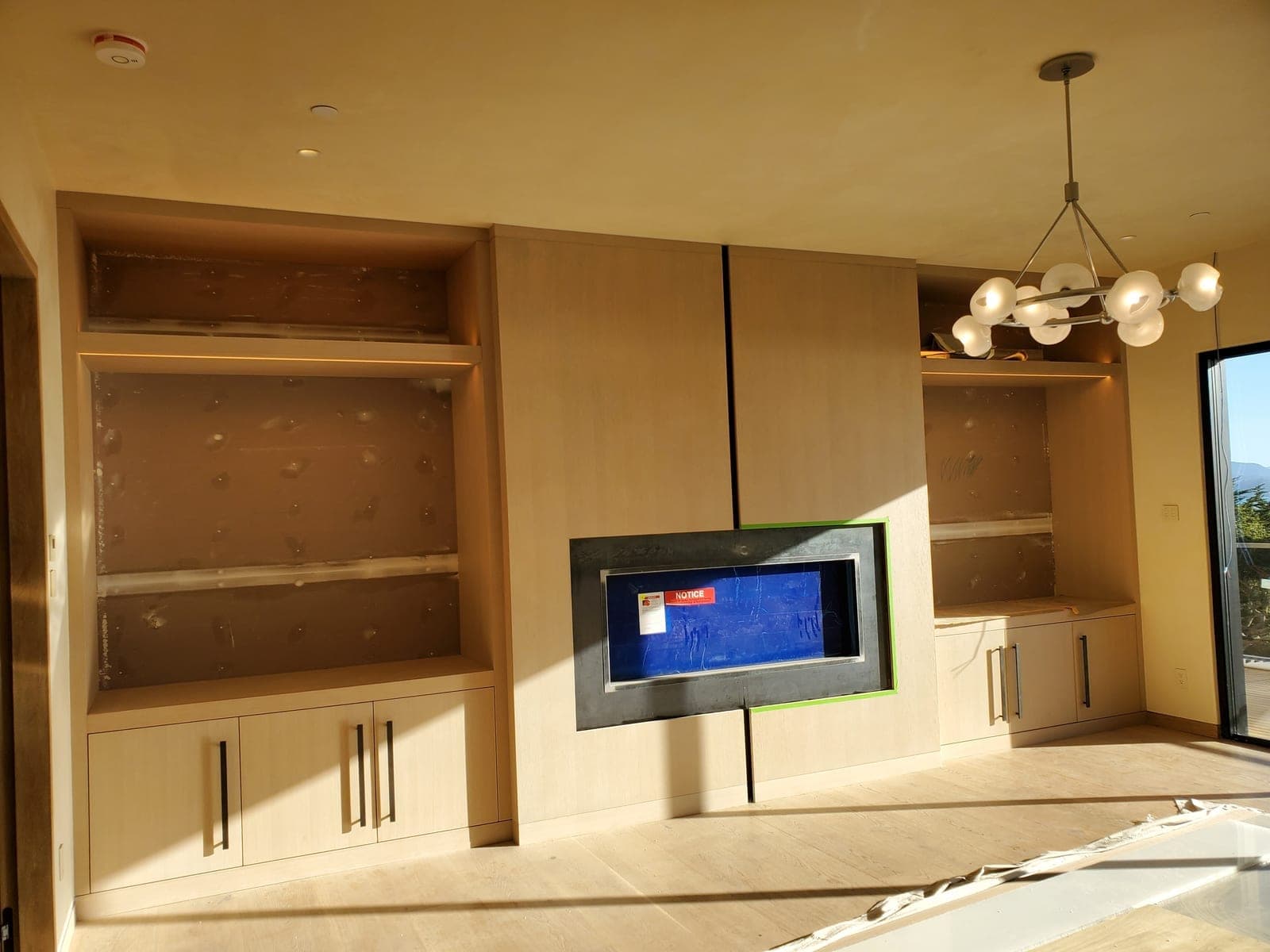 Whole-home electrical for a Cupertino custom remodel — integrated cove LED, recessed lighting, architectural chandelier circuits, and smoke detection tied into a modernized panel.