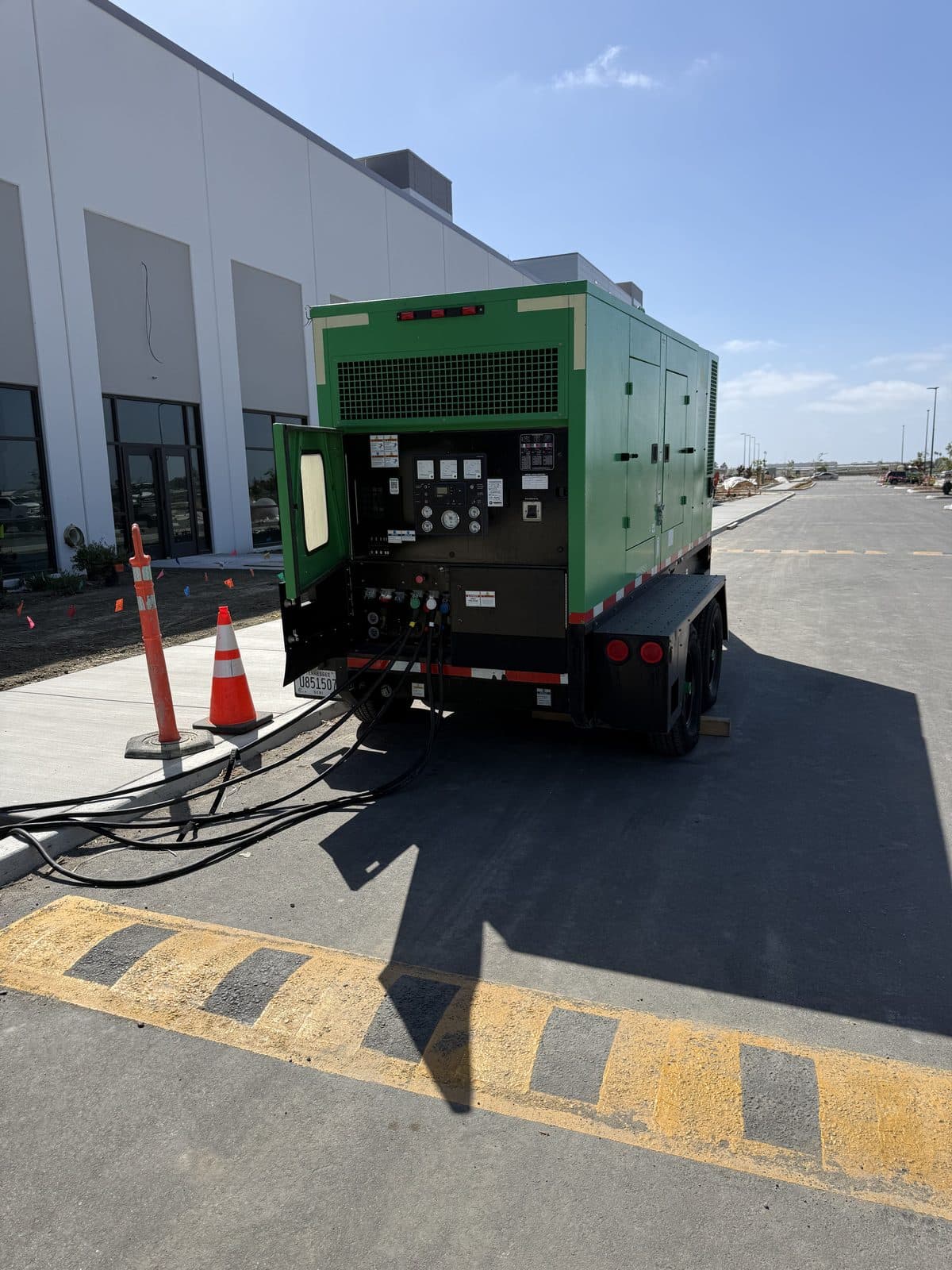 Towable commercial standby generator supplying temporary power at a job site