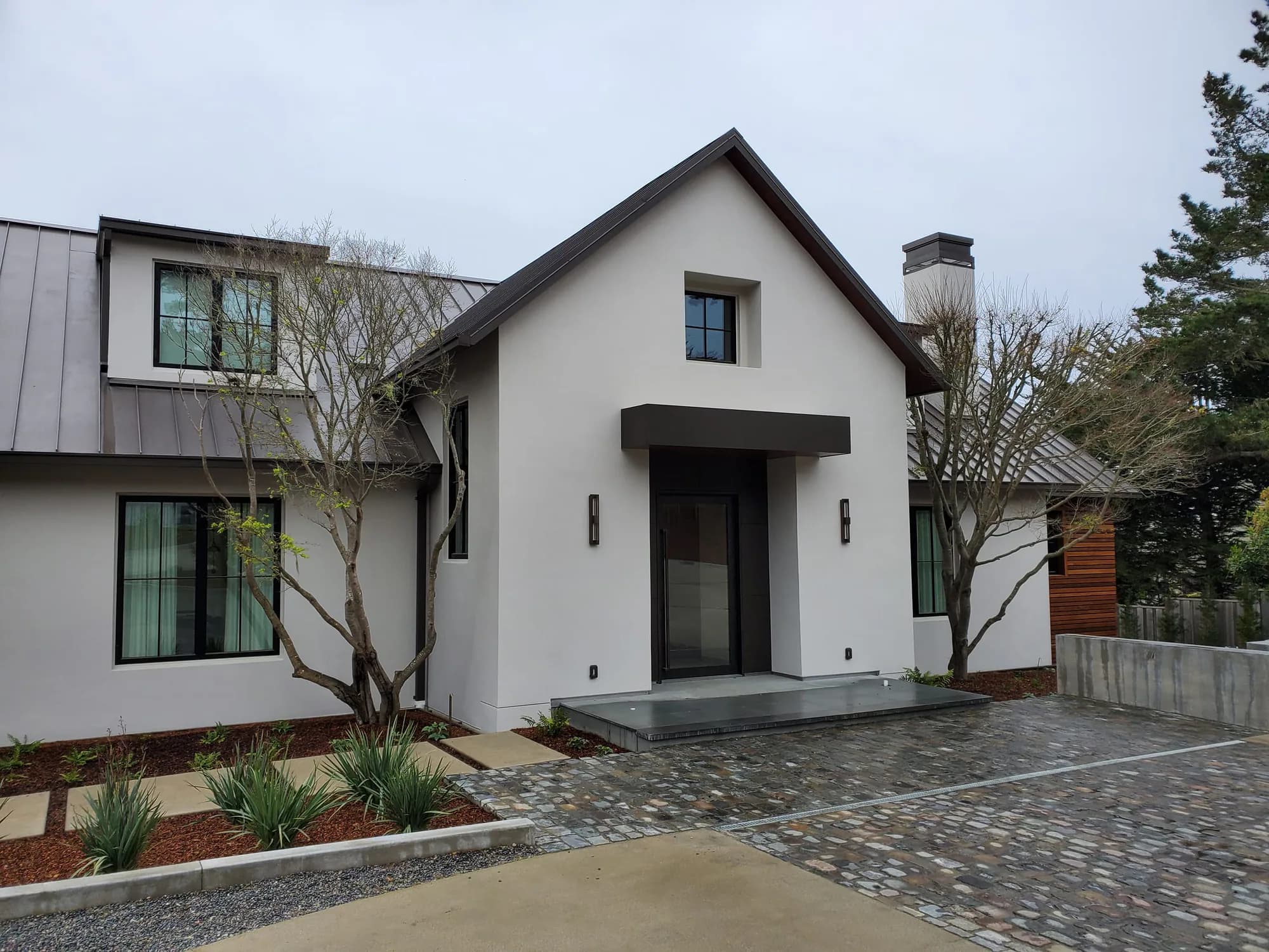 Modern home entrance with architectural exterior lighting
