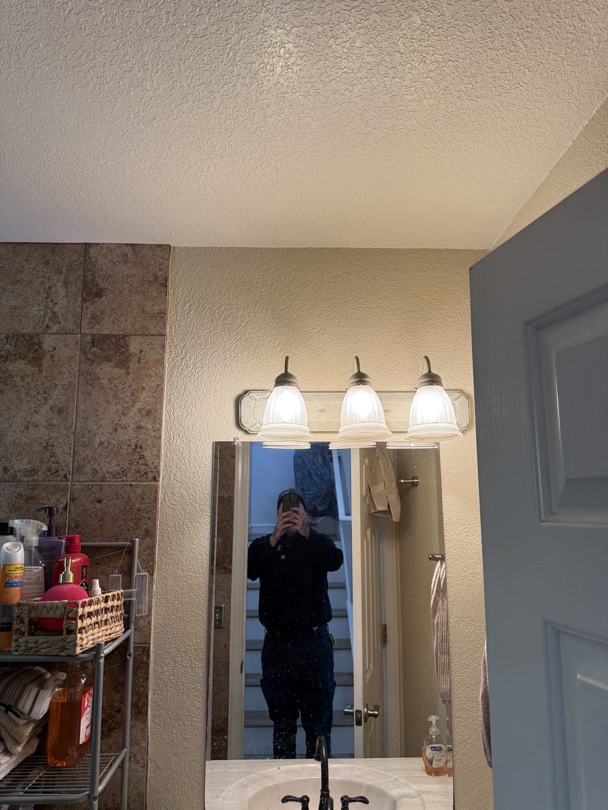 Bathroom vanity lighting before upgrade in Los Altos Hills