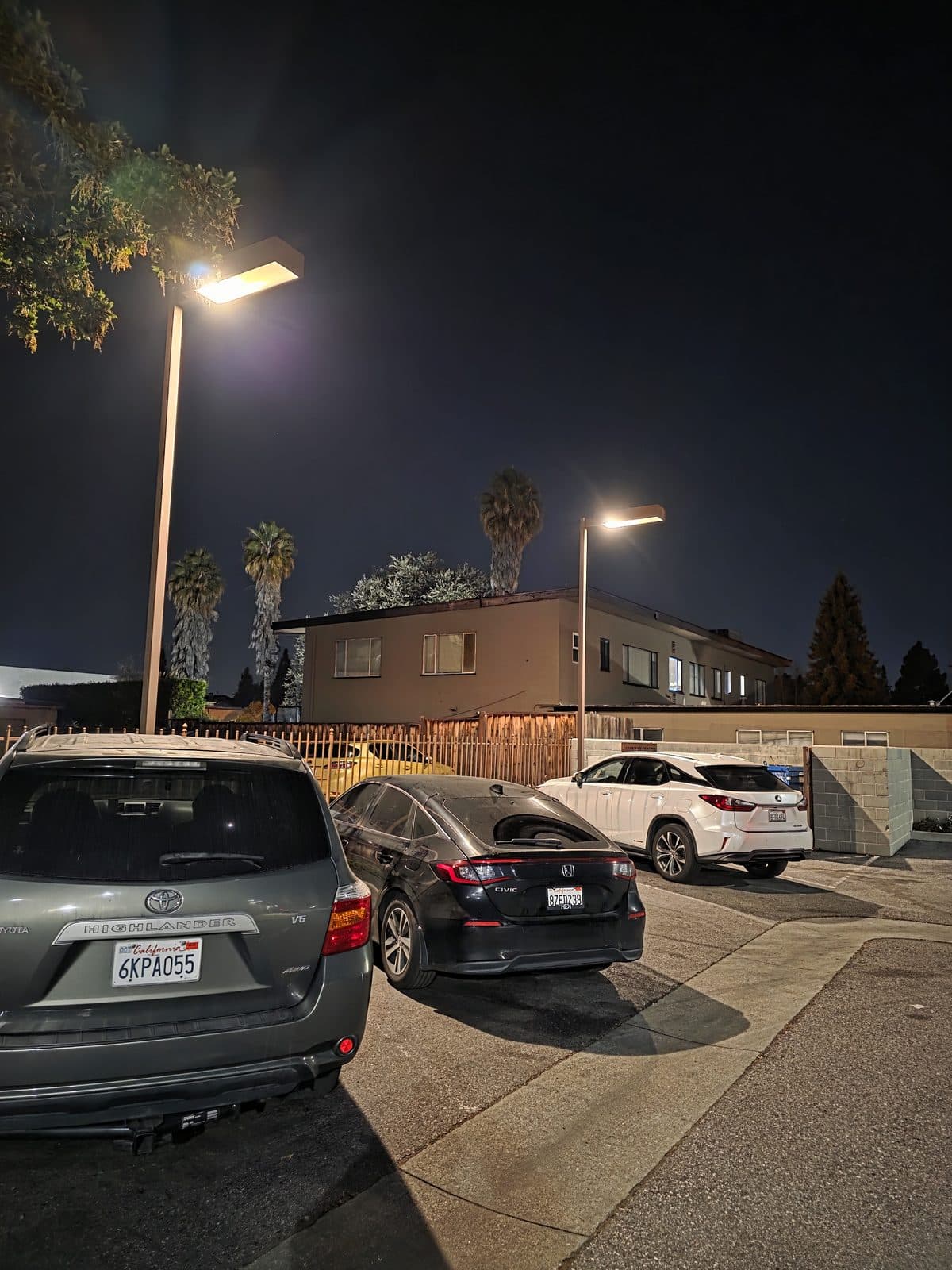 Parking lot lit evenly and brightly at night after an LED repair