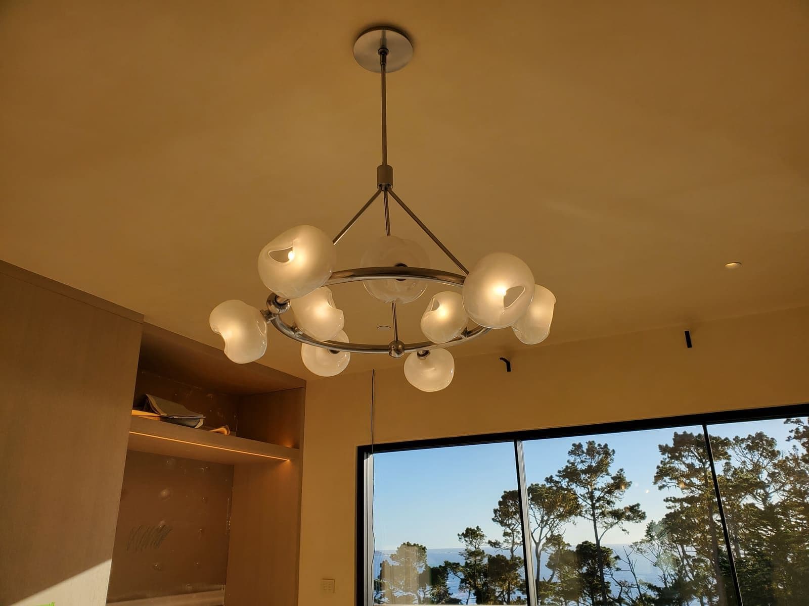 Globe chandelier with illuminated bulbs