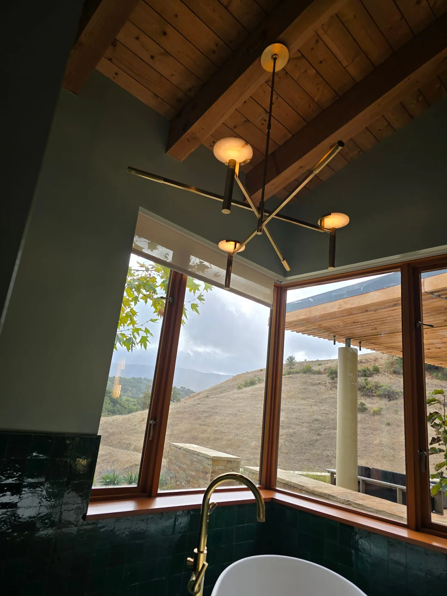 Pendant light installed beside a window