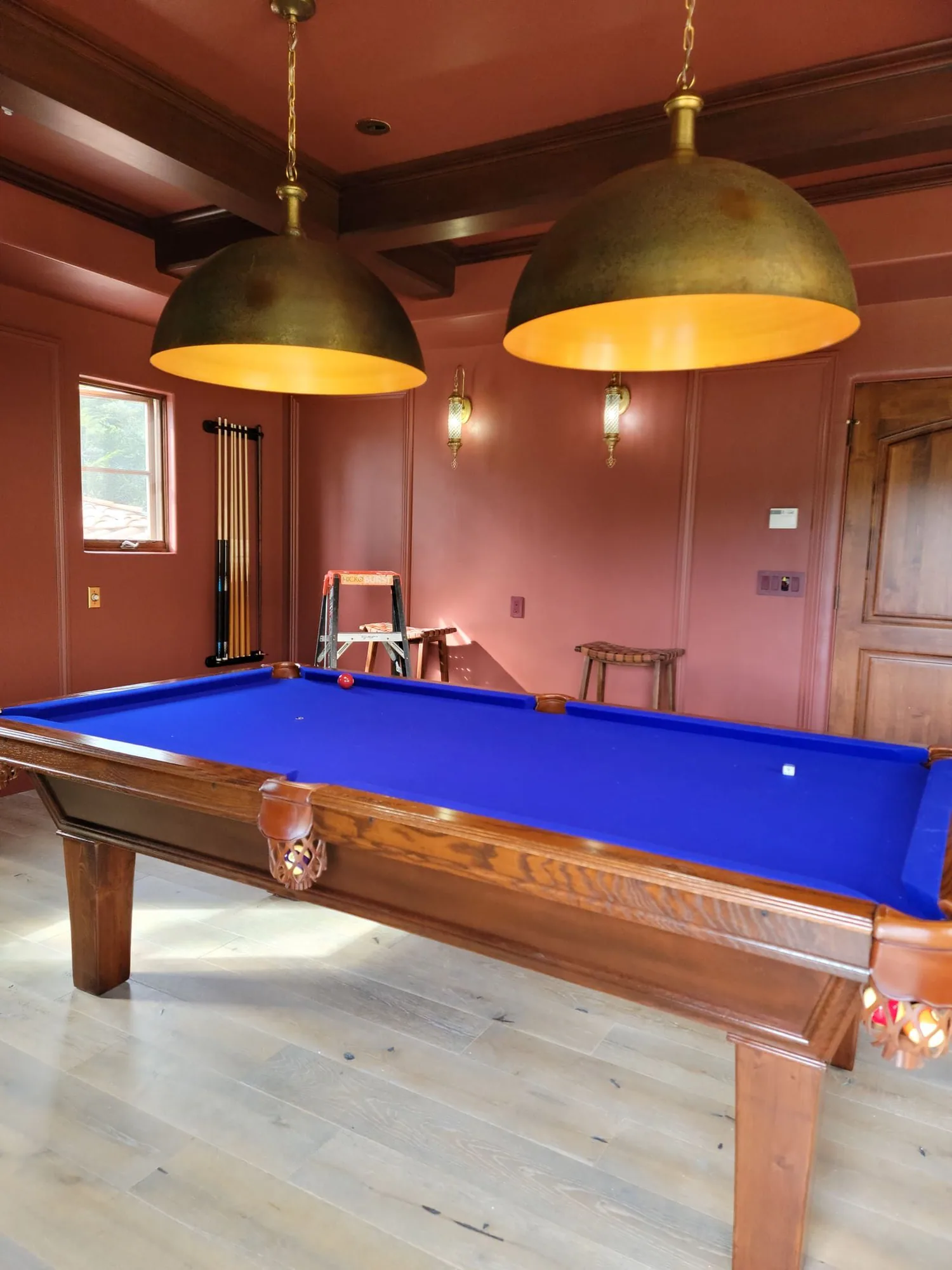 Pendant lights above a billiard table
