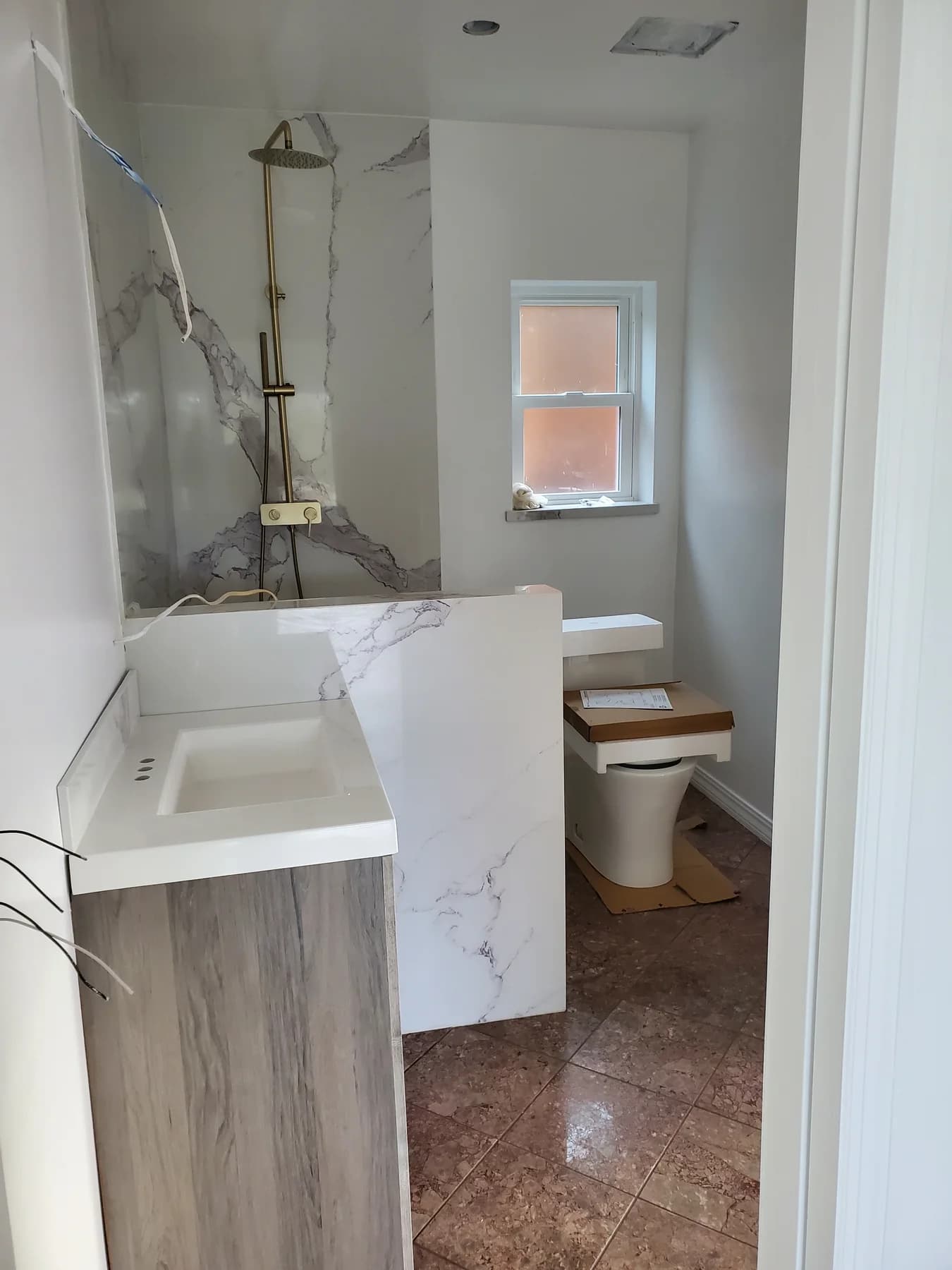 Accessory-dwelling-unit bathroom with unfinished fixture locations