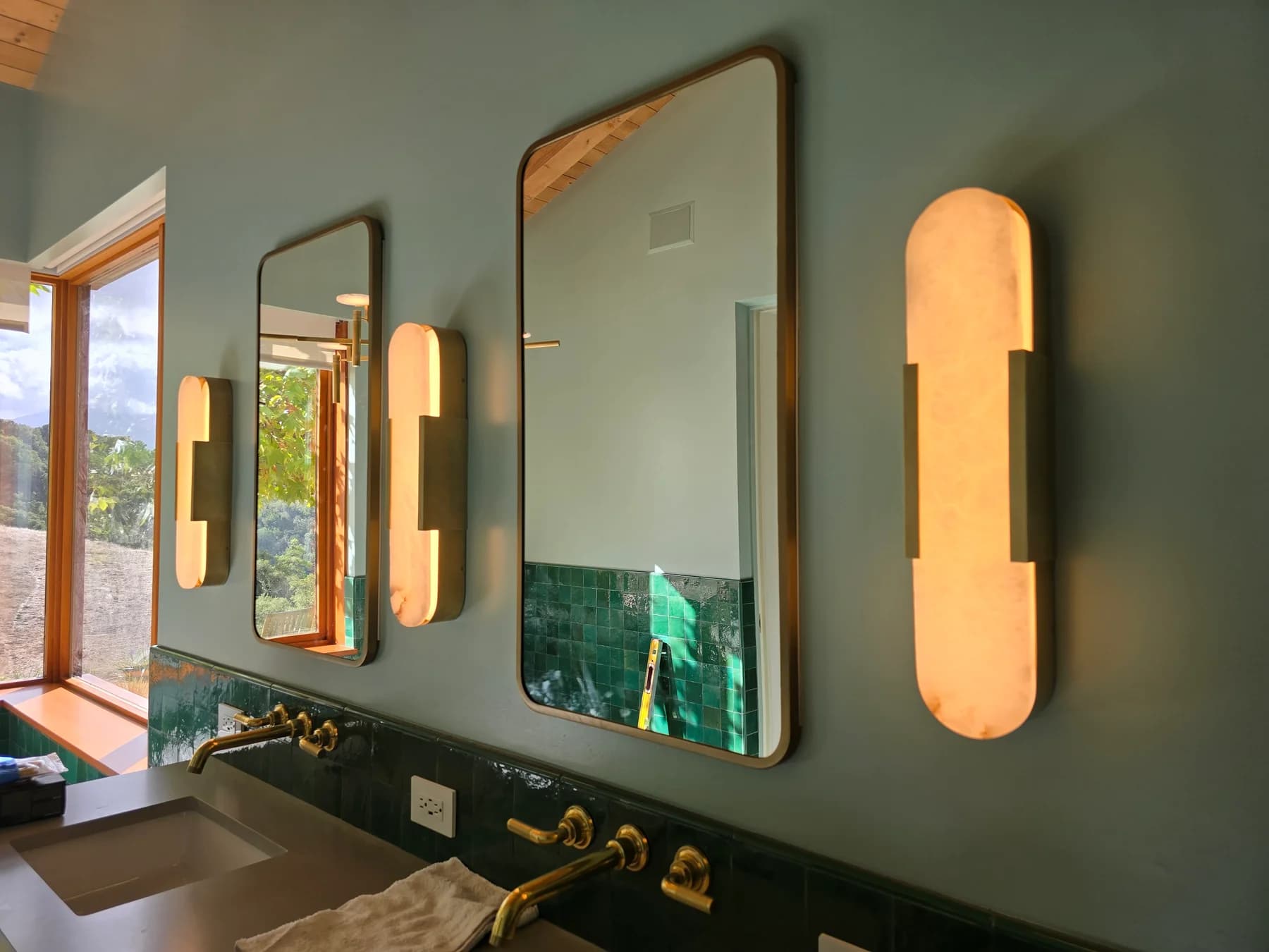 Bathroom vanity area with pendant lighting
