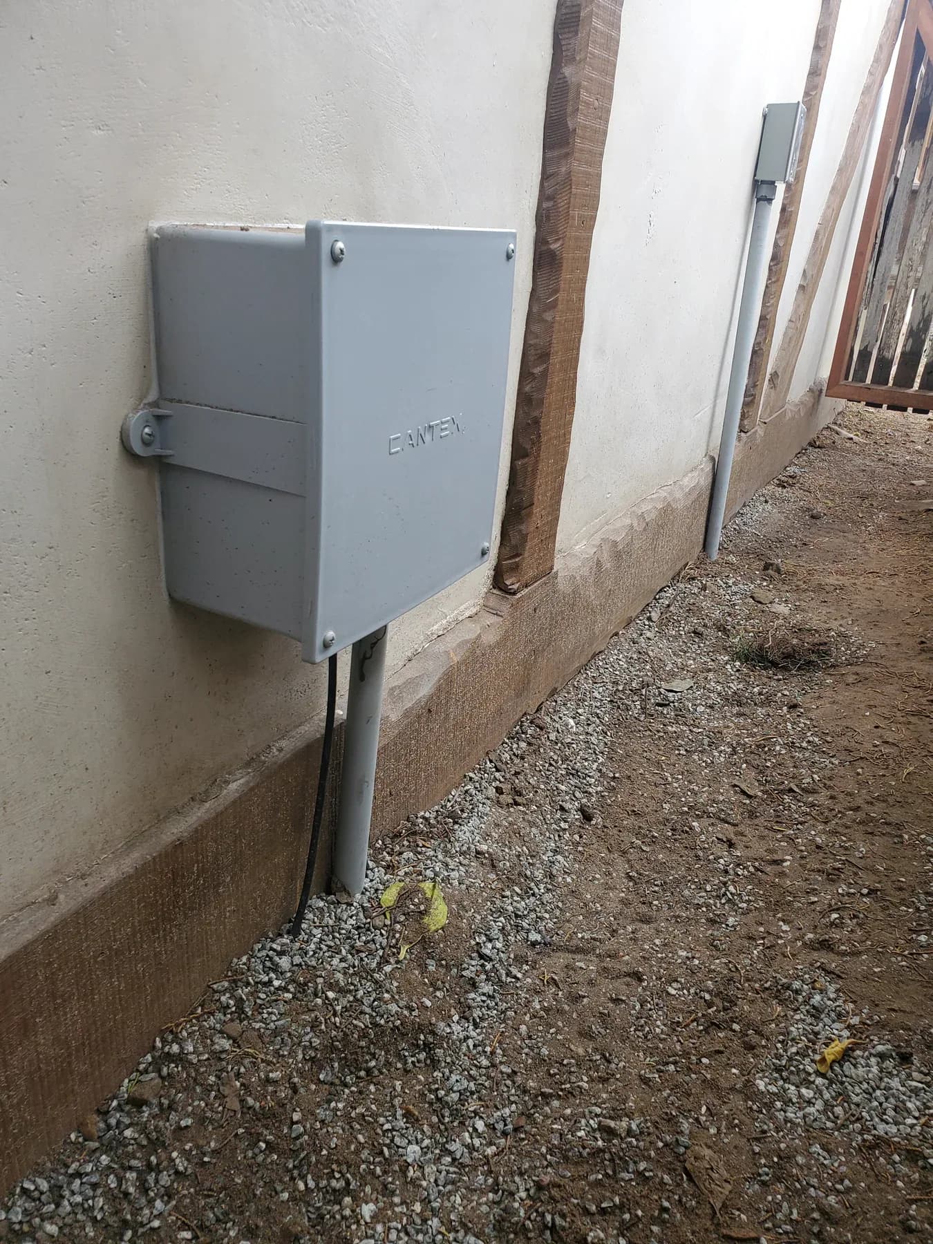 Weatherproof junction box and raceway on an exterior wall