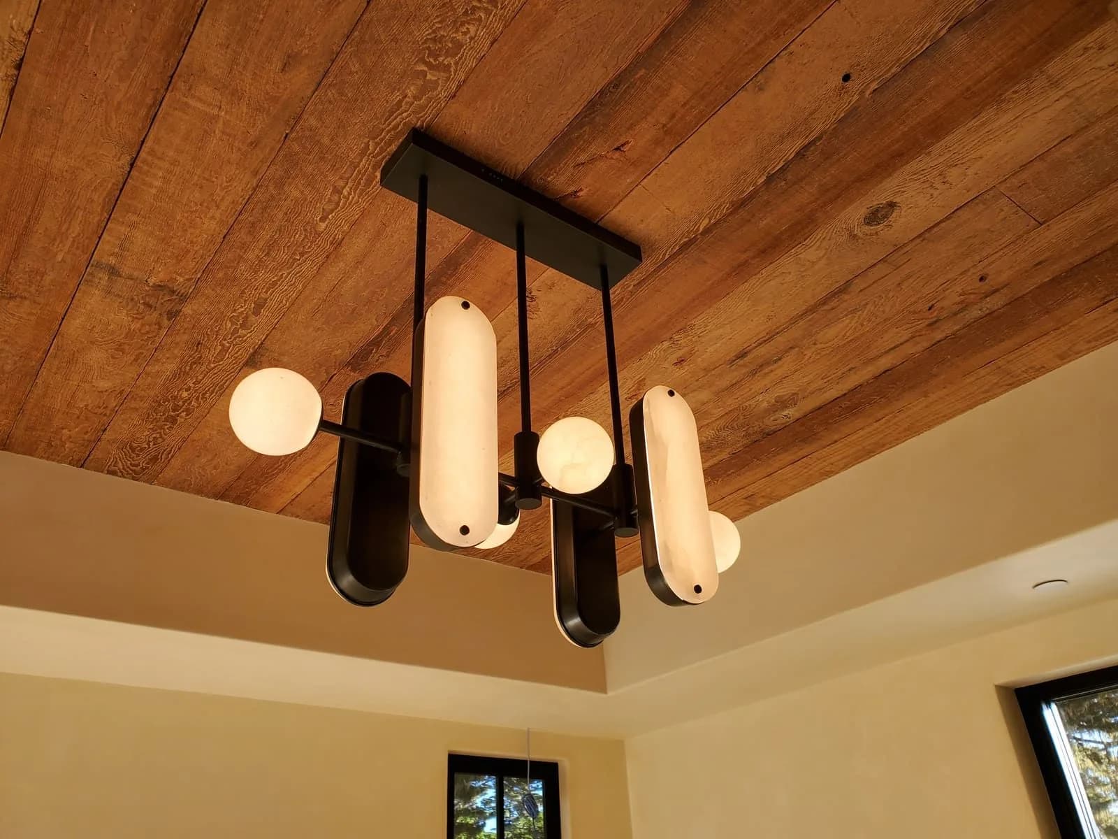 Close view of a decorative ceiling fixture with multiple arms