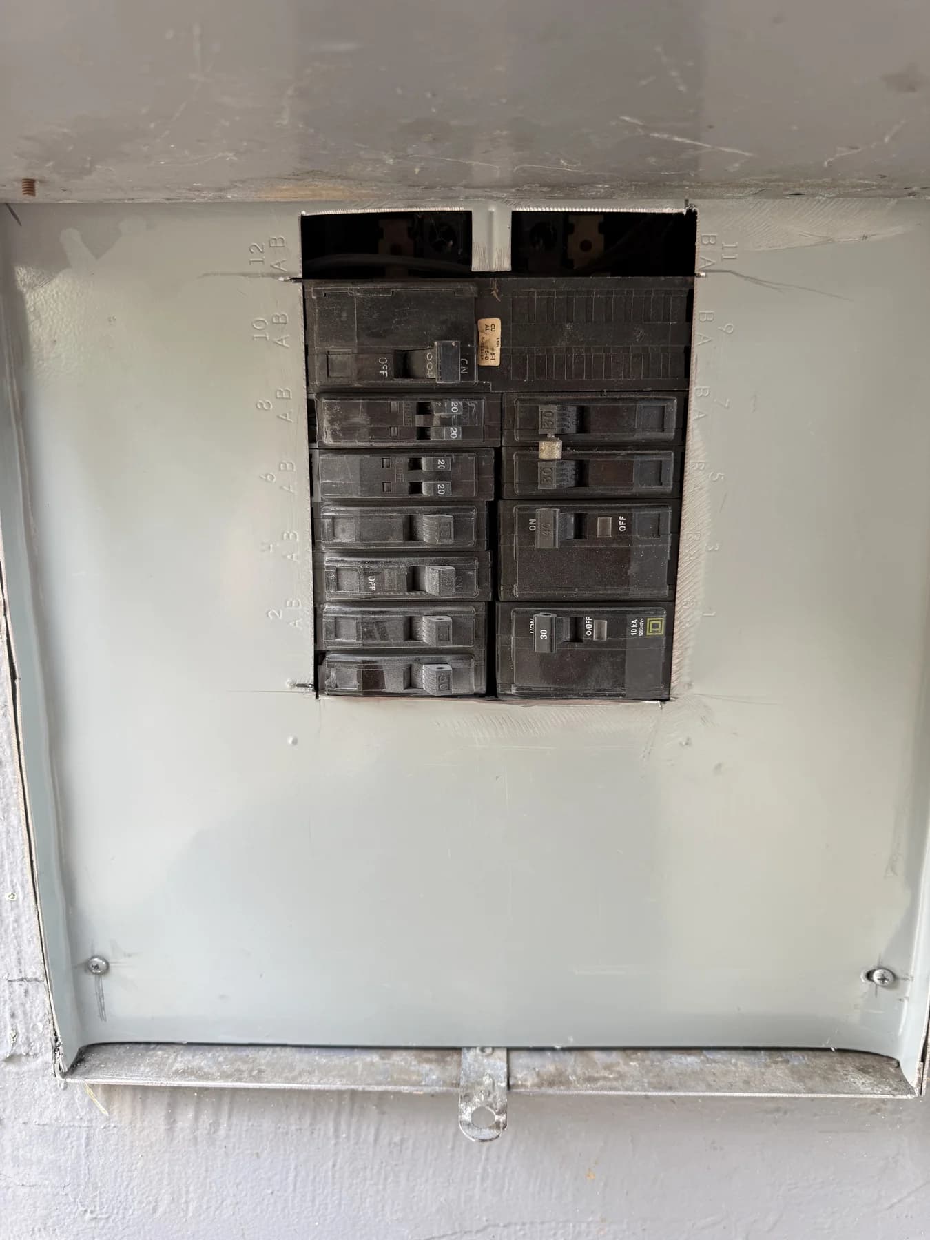 Electrical panel with open spaces before blank fillers were installed