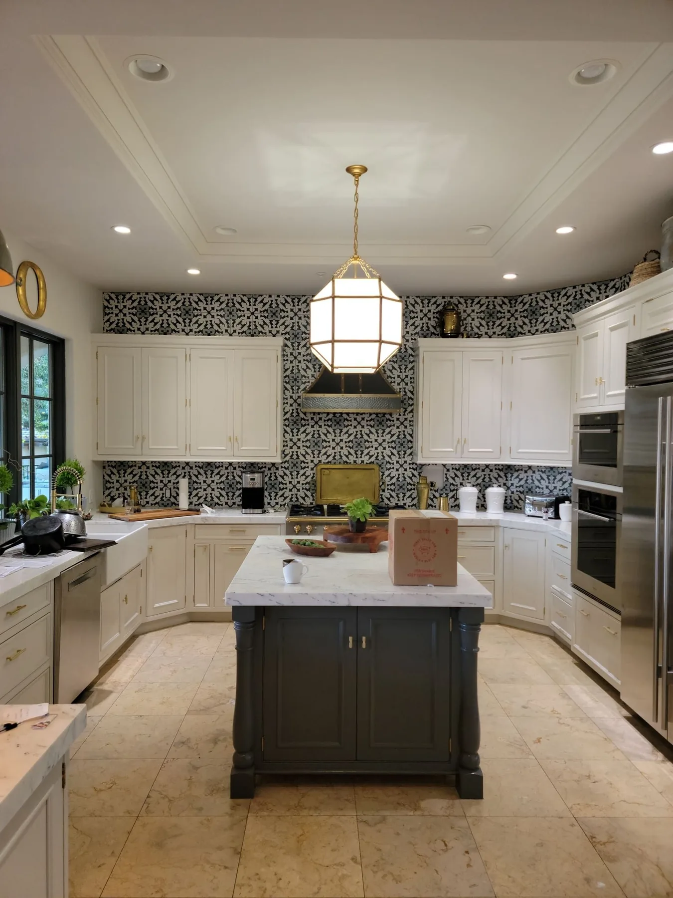 Several pendant lights above a kitchen island
