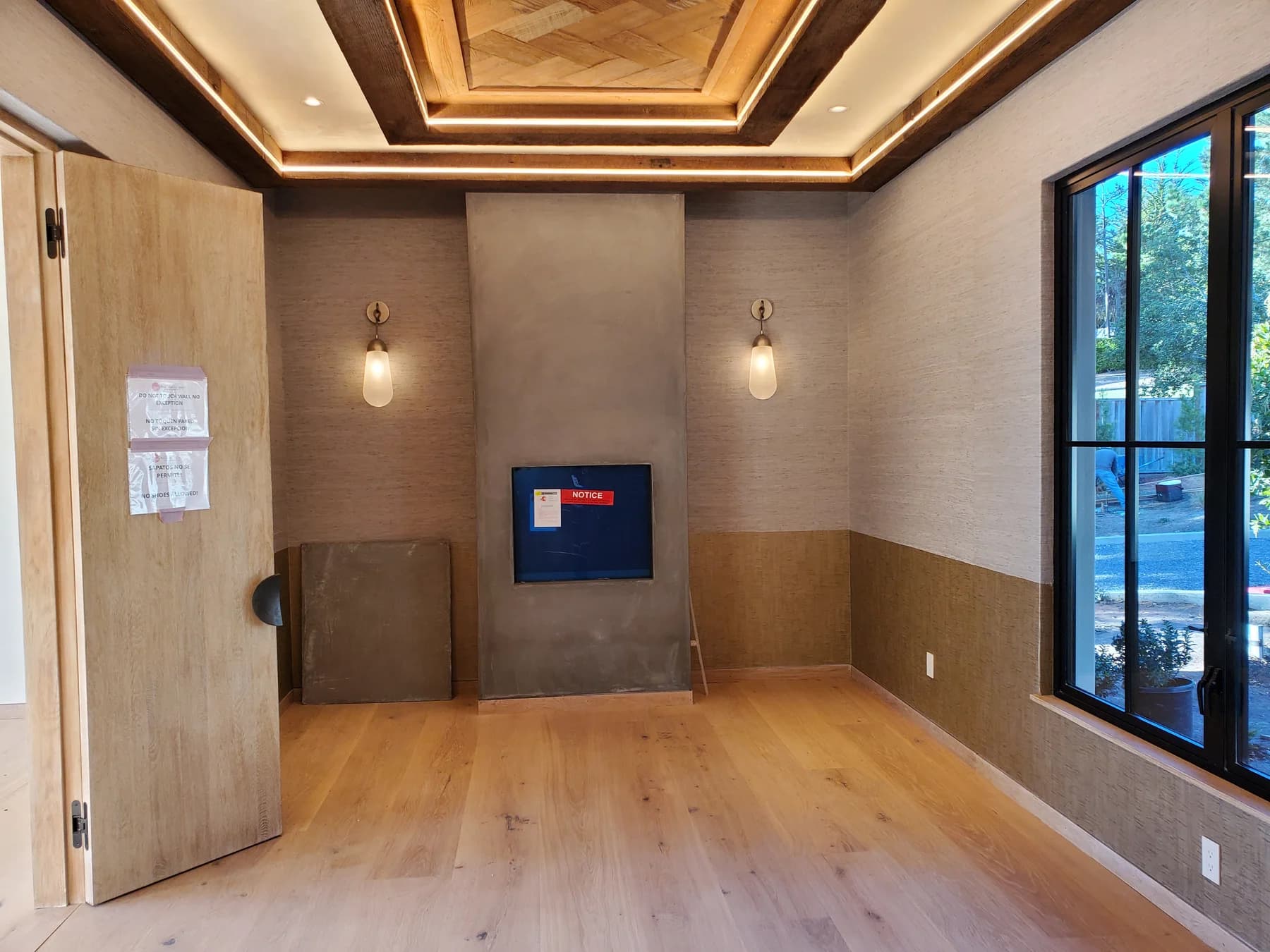 Finished interior with pendant fixtures and cove lighting