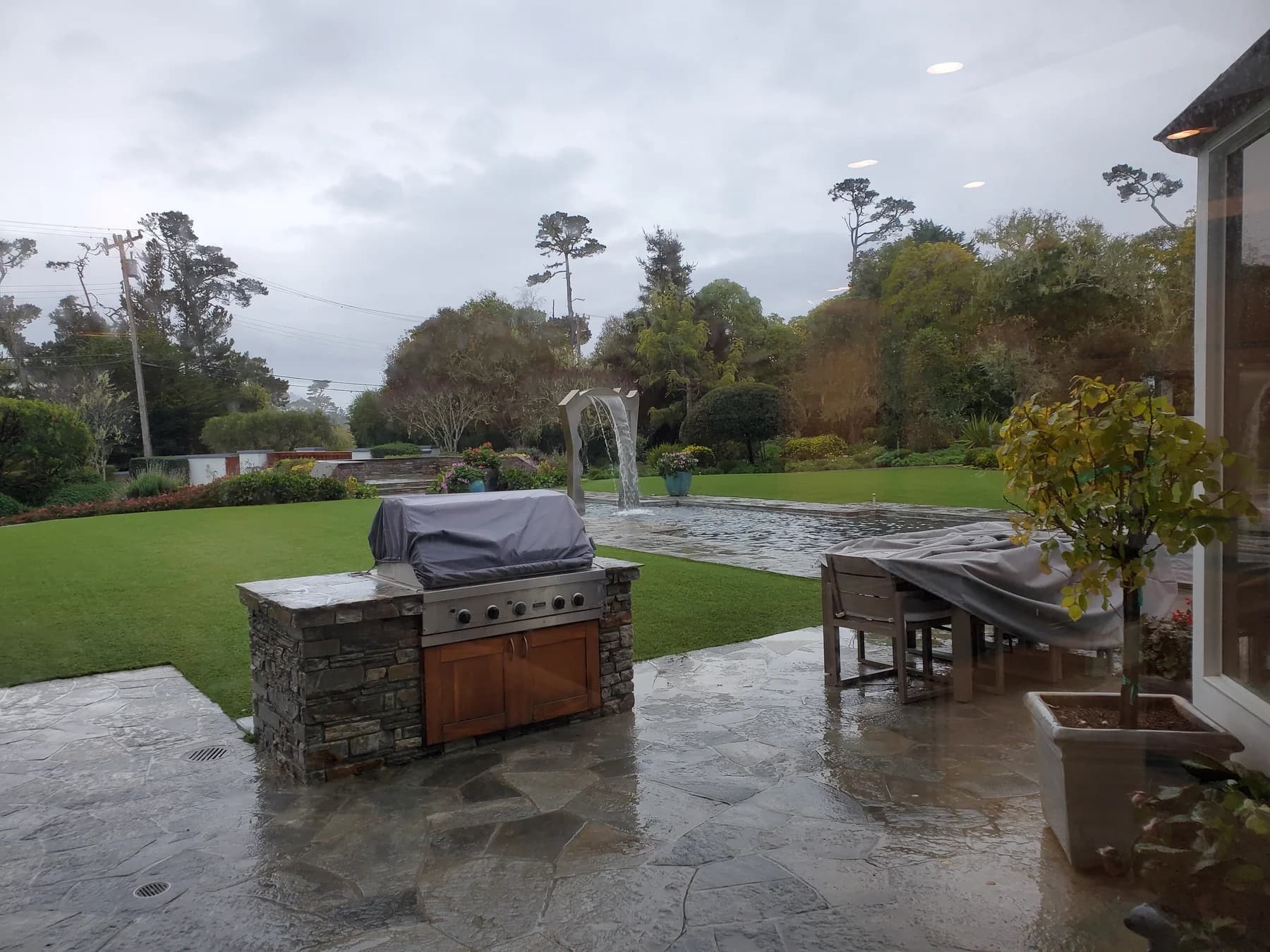 Finished outdoor kitchen counter and grill setting
