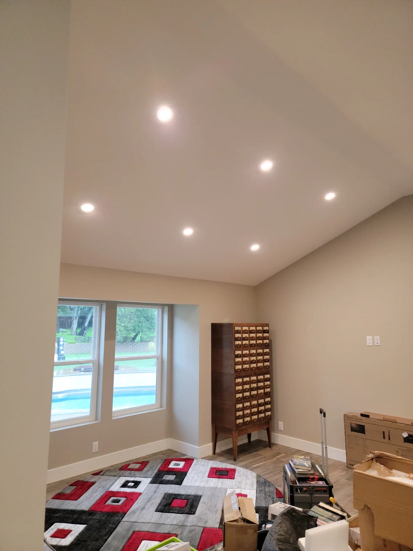 Finished San Jose room with recessed ceiling lights and wall controls