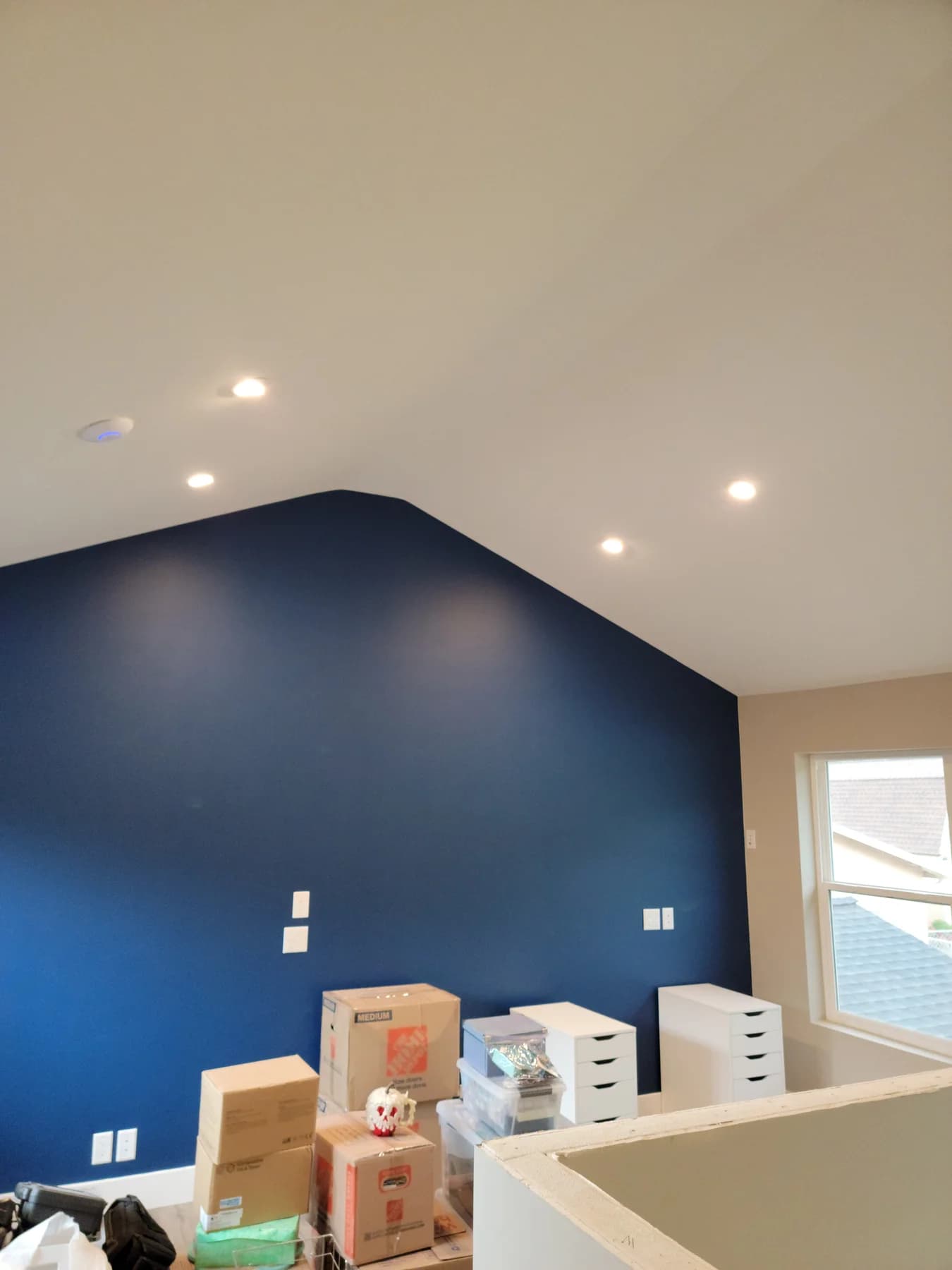 Finished San Jose room with recessed ceiling lights and wall controls