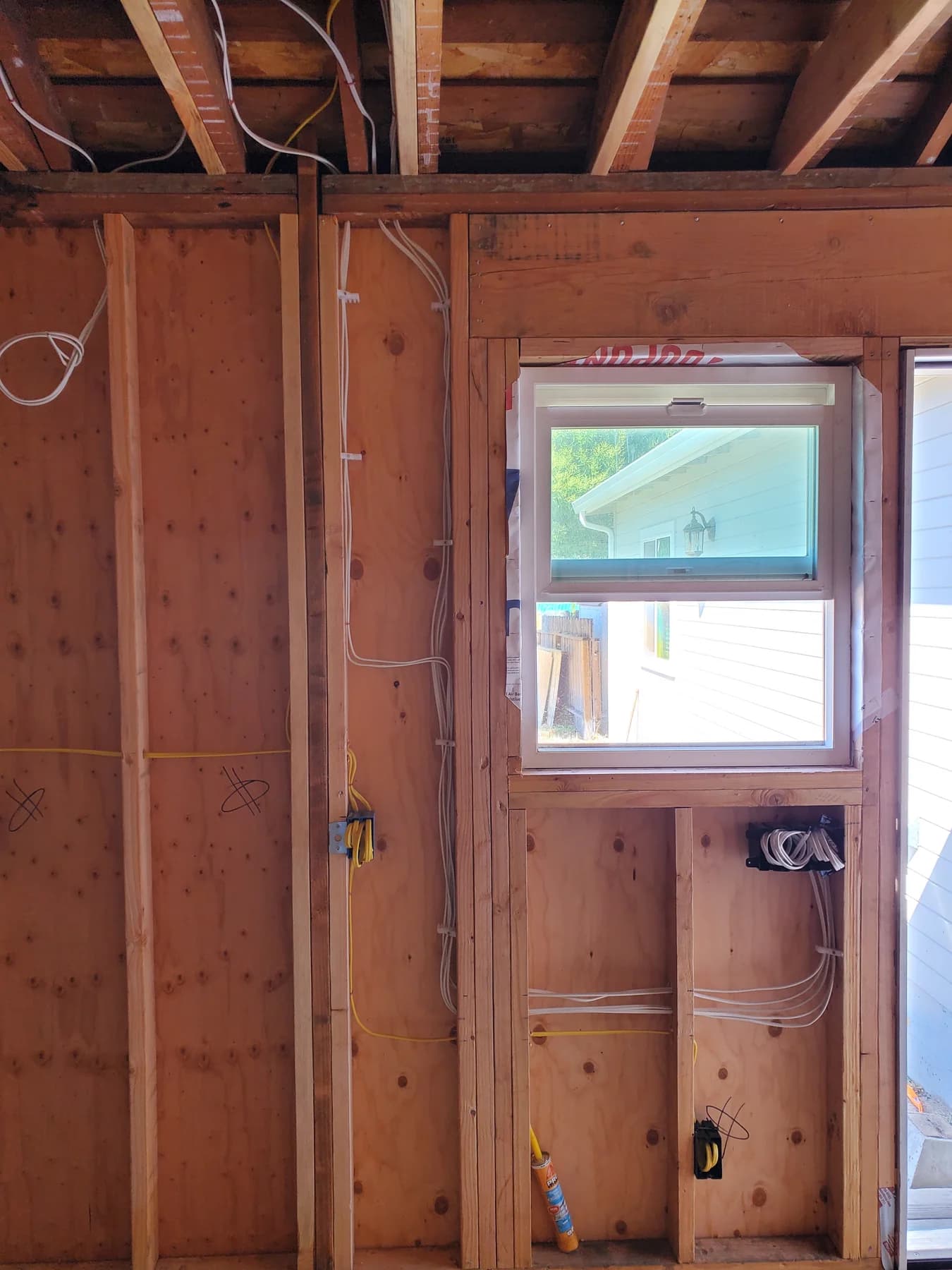 New electrical cable and boxes in open residential framing