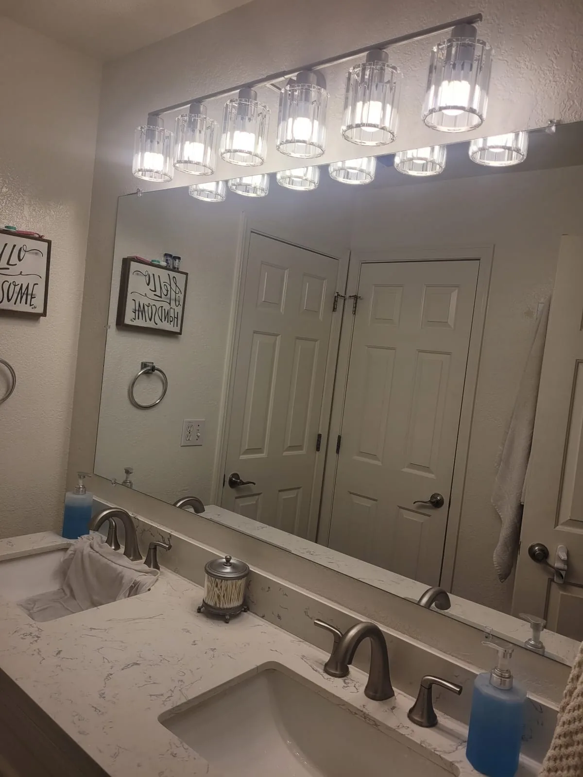 Bathroom vanity with a long, even light above the mirror