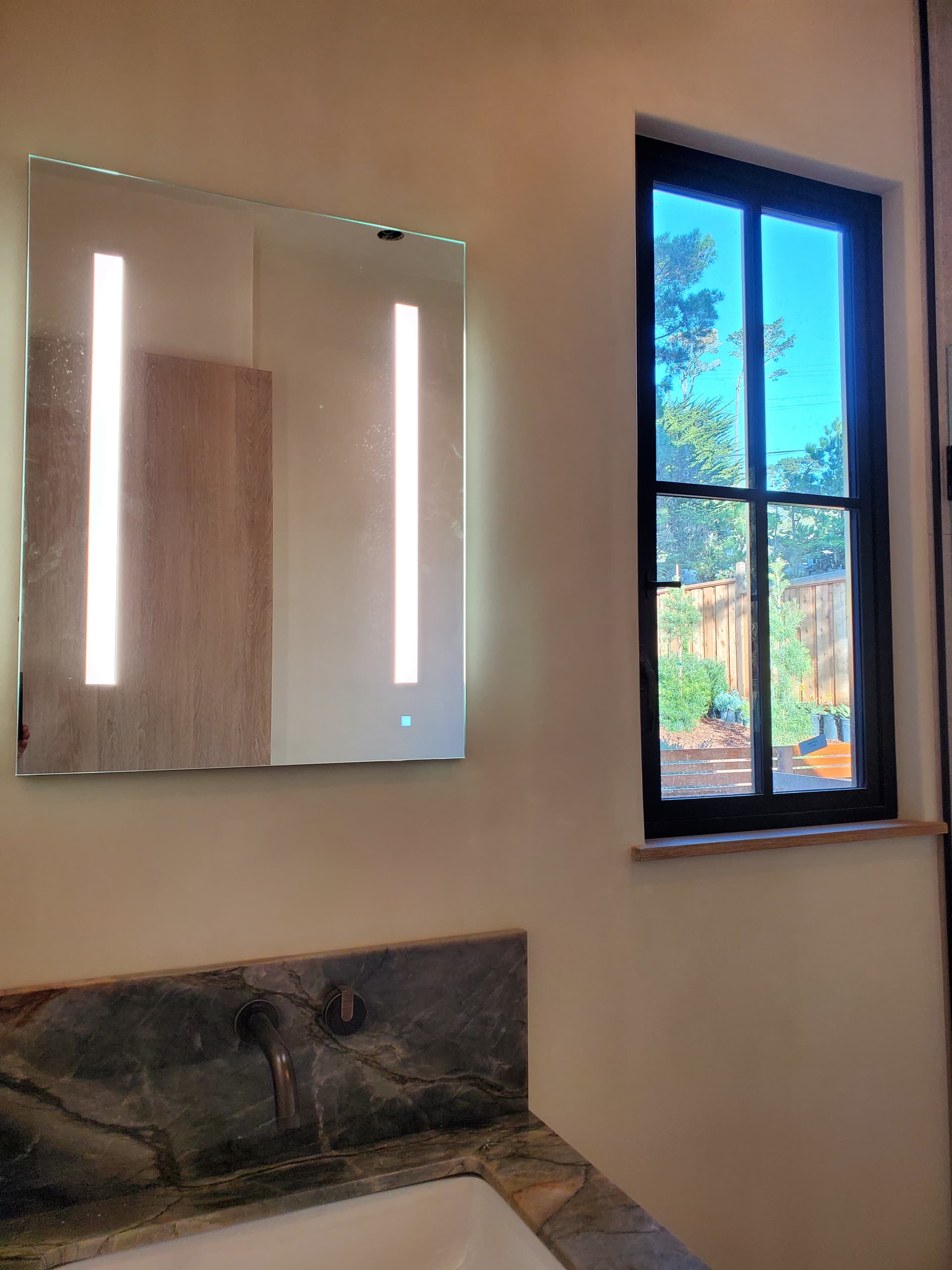 Backlit LED vanity mirror installation in a Palo Alto, CA bathroom remodel