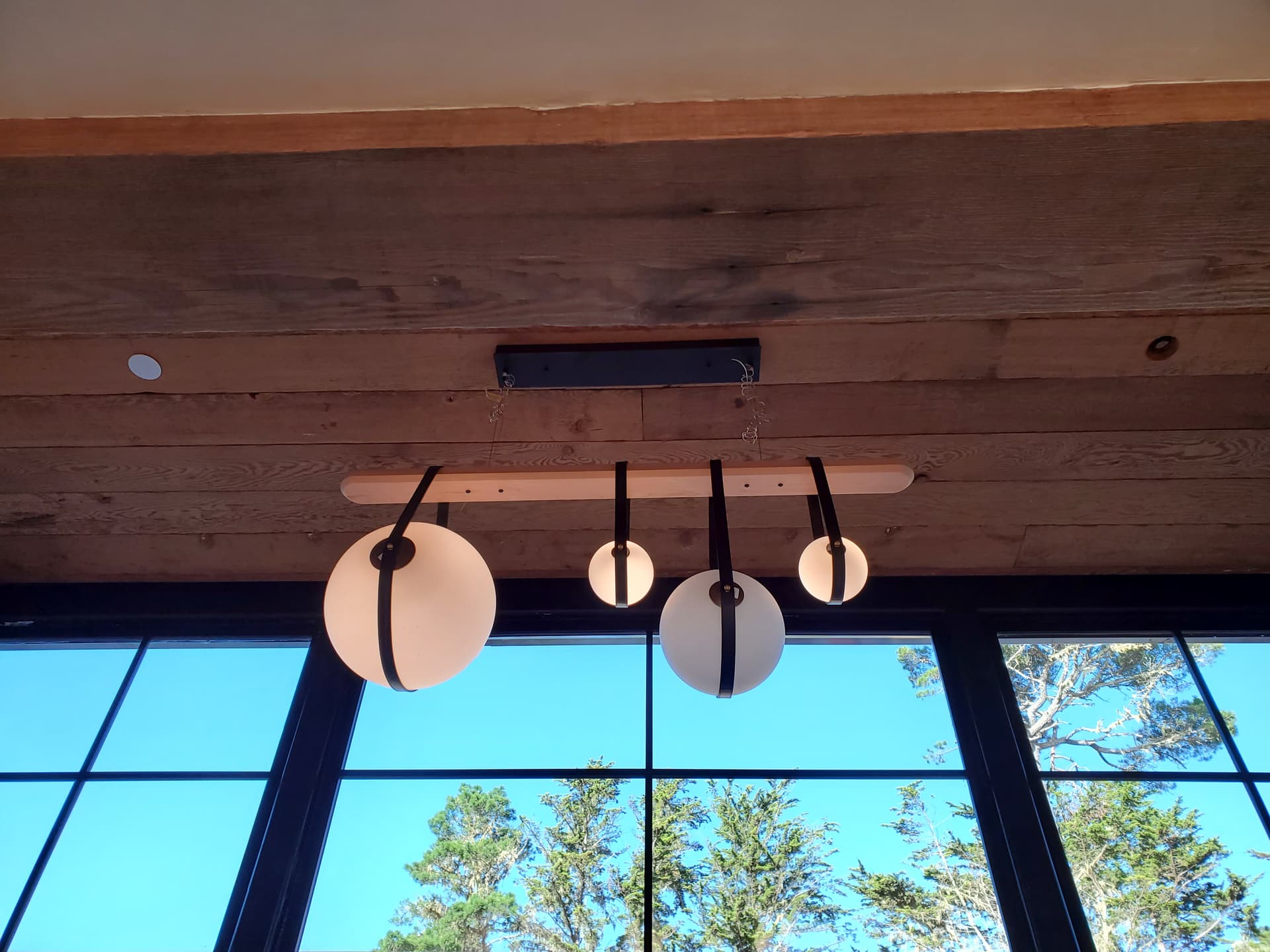 Custom pendant light fixture installation on a wood-beam ceiling in Palo Alto, CA