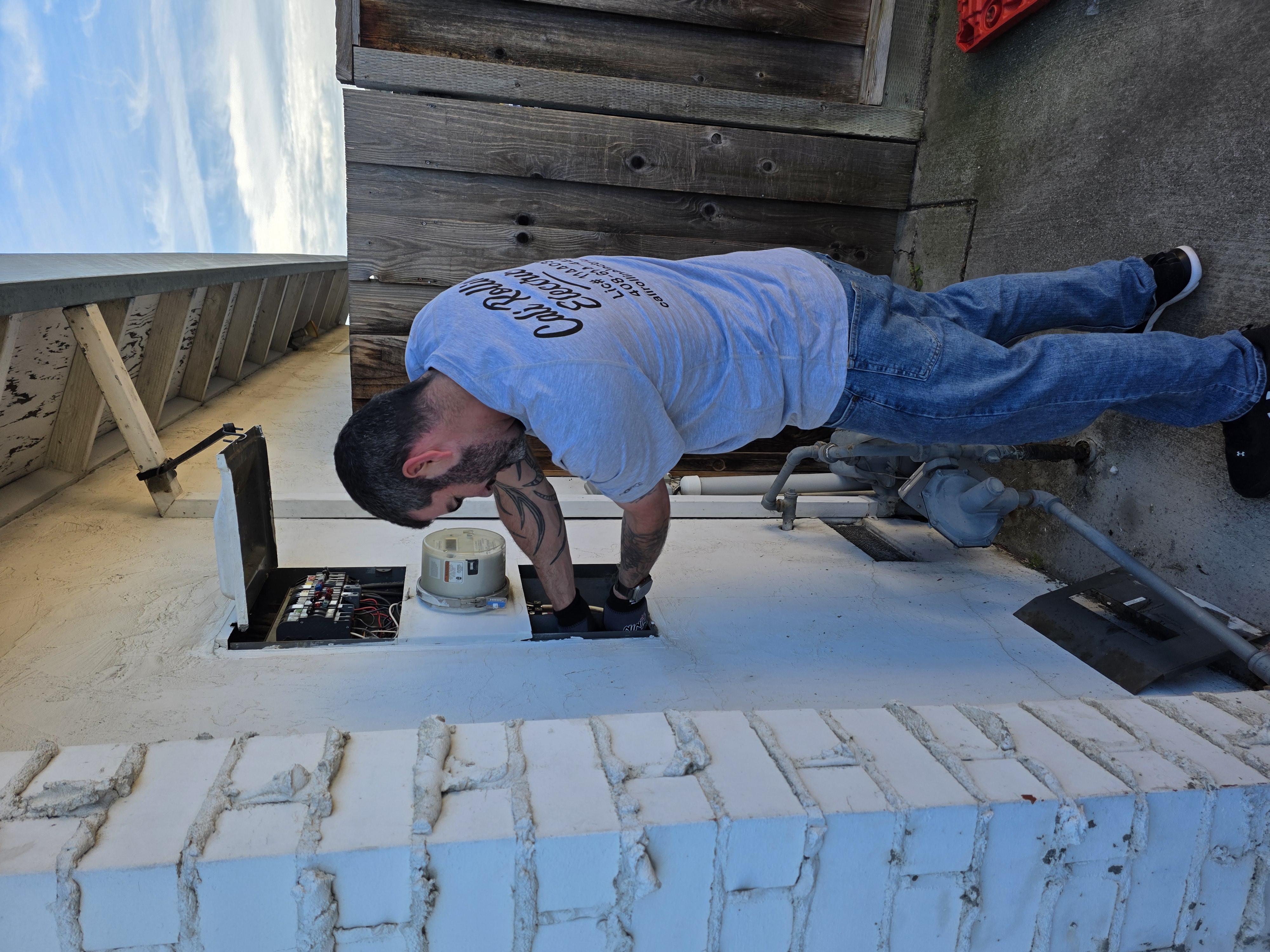 Electrician working in a service panel