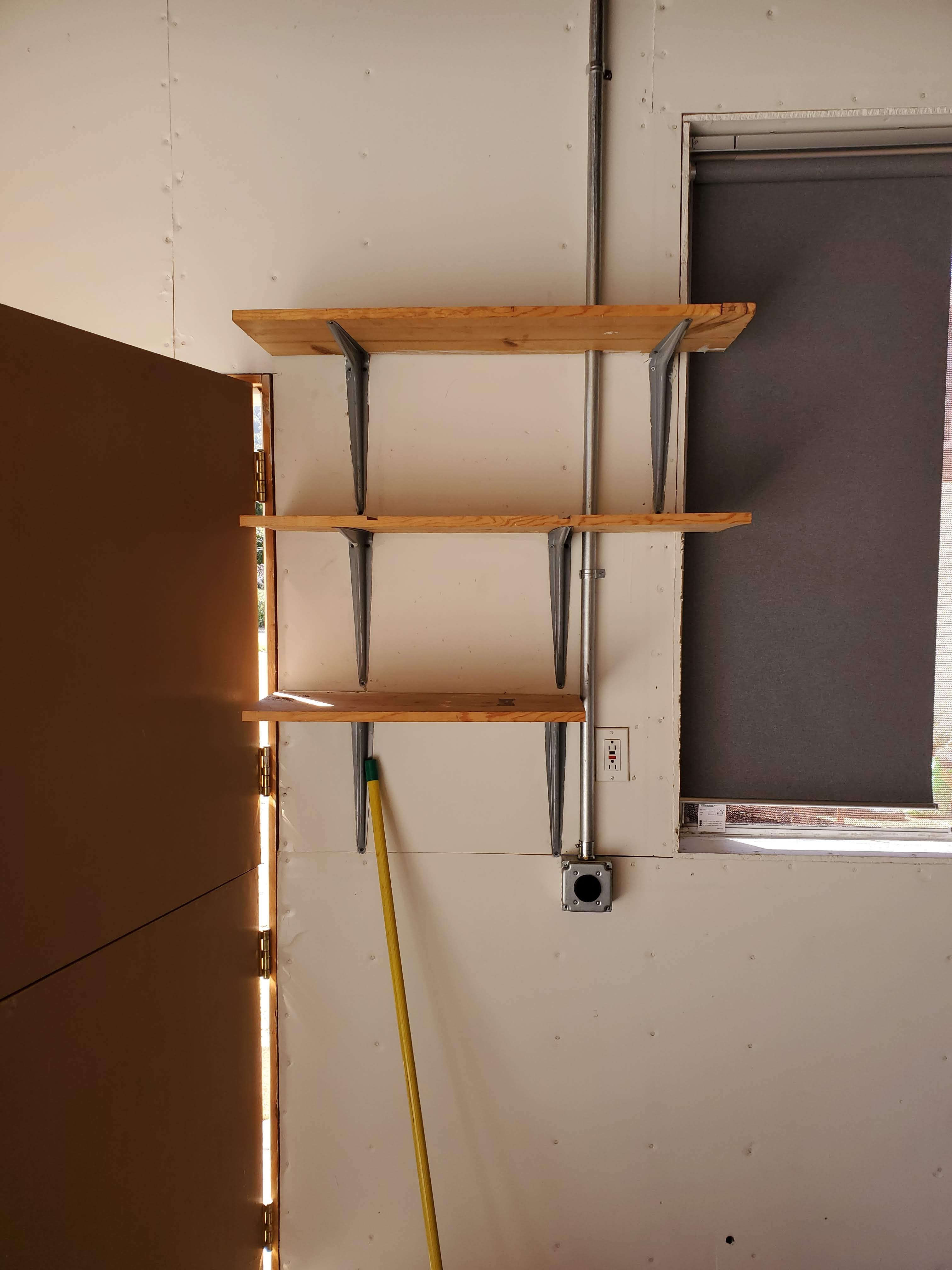 EV charger installed around existing garage shelving